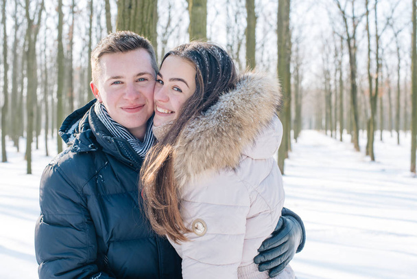 couple having fun in snowy park - Zdjęcie, obraz