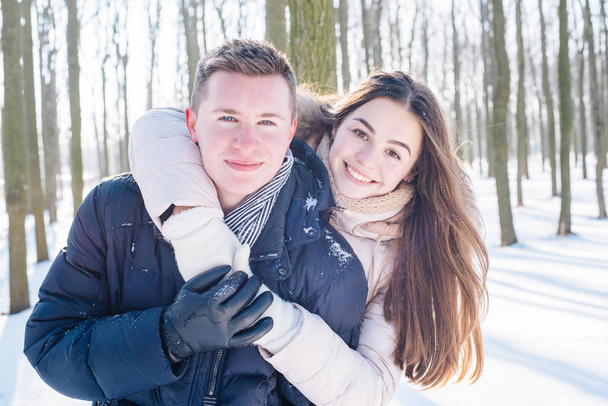 couple having fun in snowy park - Photo, Image