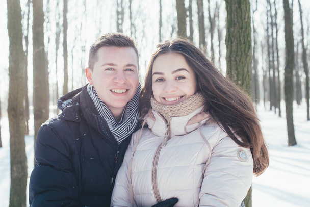 couple having fun in snowy park - Photo, Image