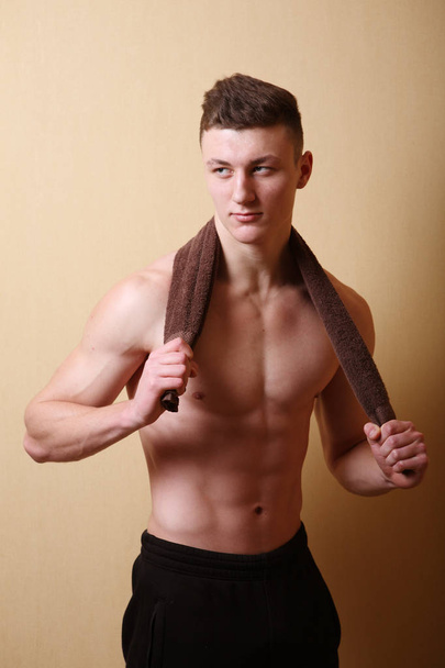 A young man demonstrates torso - Фото, изображение