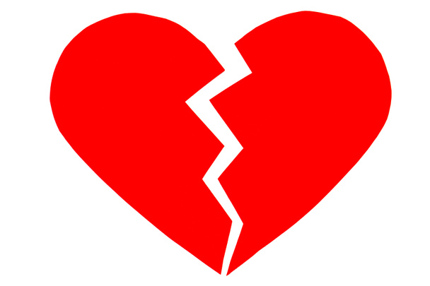 Red heartbreak / broken heart. close up of a paper broken heart  - Photo, Image