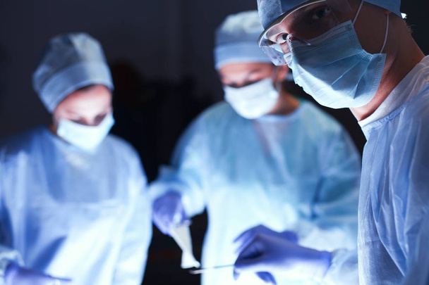 Team surgeon at work in operating room - Photo, image