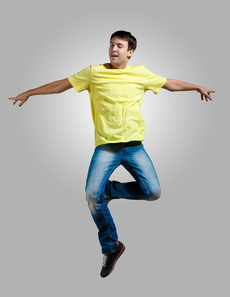 Young man dancing and jumping - 写真・画像