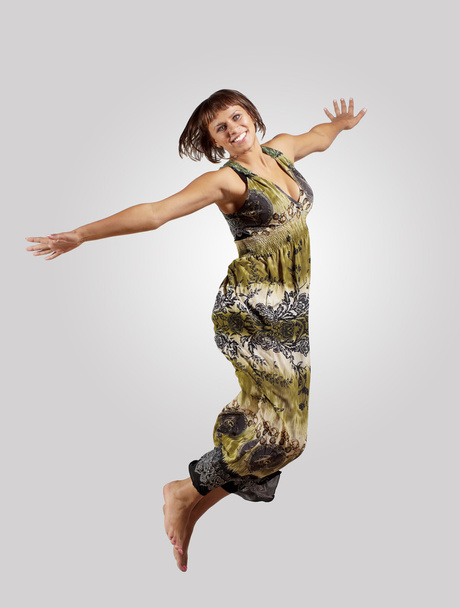Young woman dancing and jumping... - Fotó, kép
