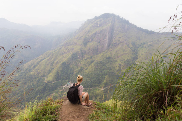 Female tourist enjoying beautiful view of tea plantations, Sri Lanka. - Fotografie, Obrázek