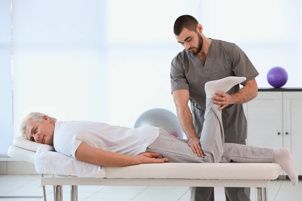 Physiotherapist working with patient  - 写真・画像