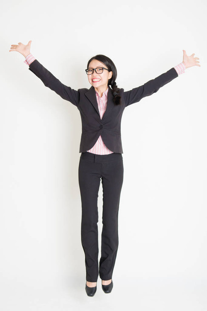 Asian businesswoman jumping - Fotoğraf, Görsel