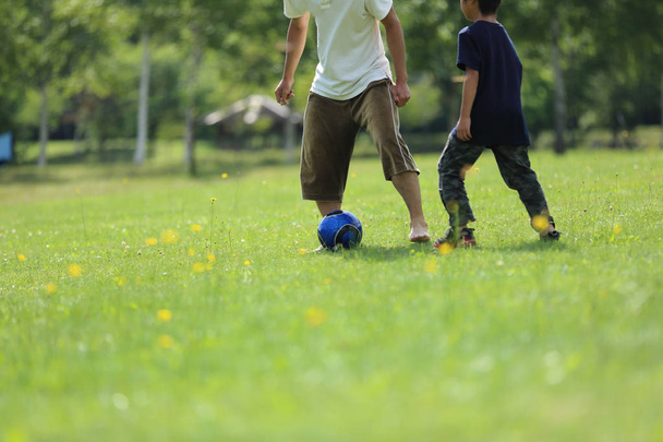 Parents playing soccer in japan - Foto, imagen