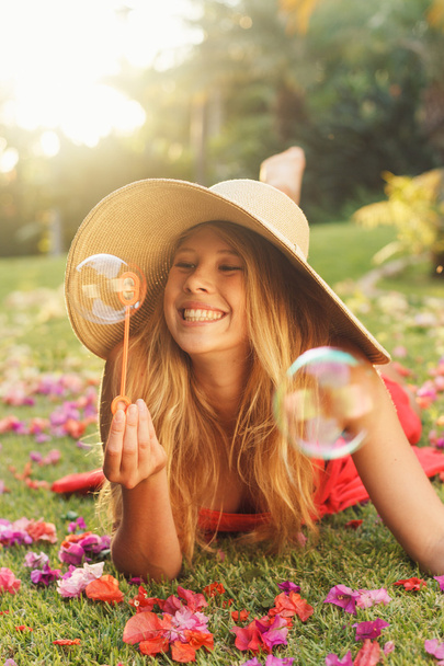 Beautiful Woman Blowing Bubbles - Photo, image