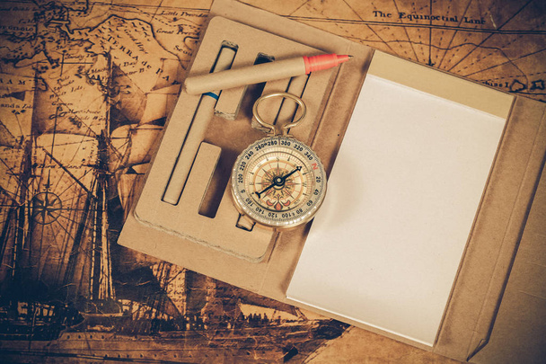 Compass with note book on old map vintage process style - Fotó, kép