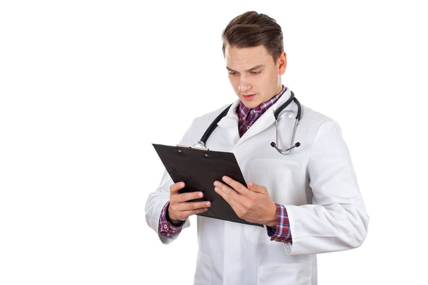 Young male doctor holding insurance forms - Photo, image