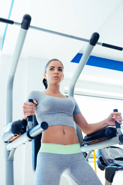 Fitness woman exercising in gym - Fotó, kép