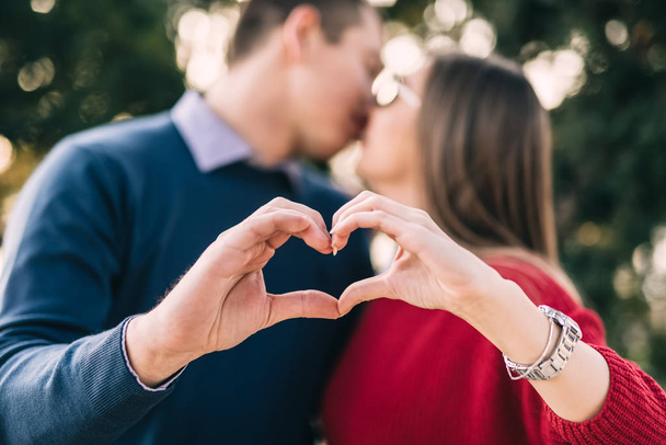 Couple making heart shape with hands - Photo, image
