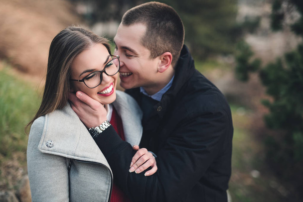 Beautiful young couple in city park - Фото, зображення