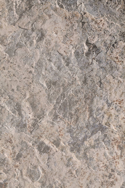 Arkaplan olarak granit duvar, alanın sığ derinliğine dikkat edin - Fotoğraf, Görsel