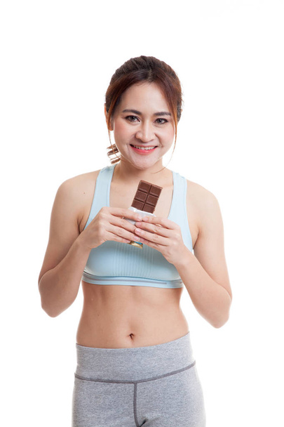 Beautiful healthy Asian girl love chocolate. - Фото, изображение
