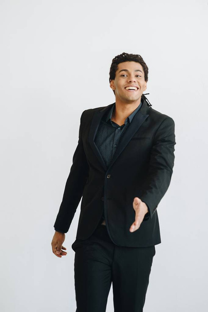 Happy young businessman in black suite - Photo, Image
