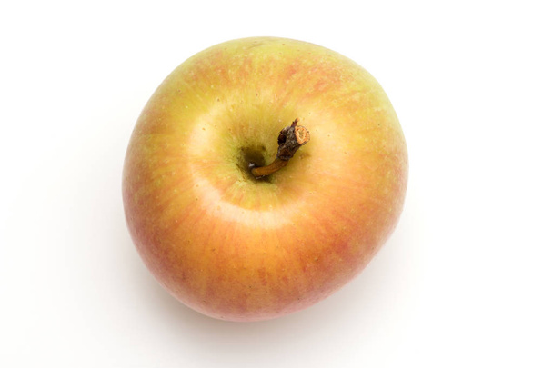 orange or yellow apple fruit isolated on white - 写真・画像