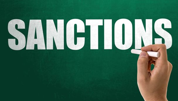 teken sancties op schoolbord - Foto, afbeelding