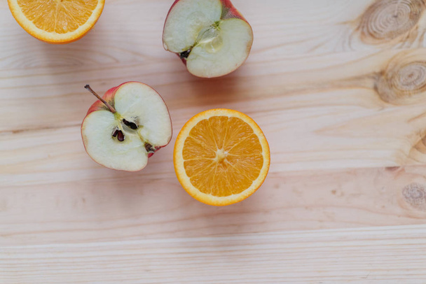 Fresh red apple, orange on wooden decks - Φωτογραφία, εικόνα