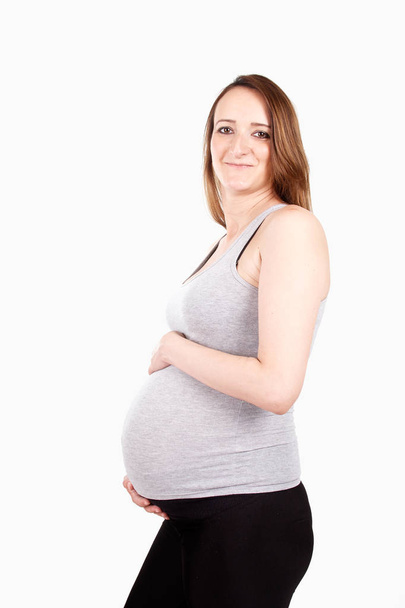 Pregnant woman standing - Fotoğraf, Görsel