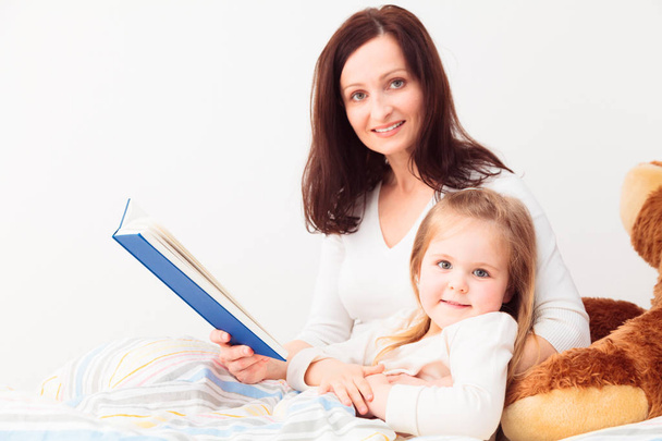 Mother Reading A Story To Her Daughter - Photo, Image