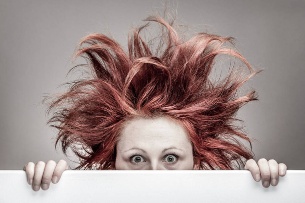 Frightened woman with messy hair - Photo, Image
