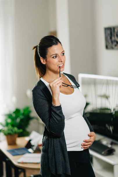Pensive pregnant woman at home - Photo, Image