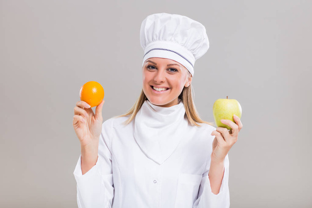 Female chef with fruit - Фото, изображение
