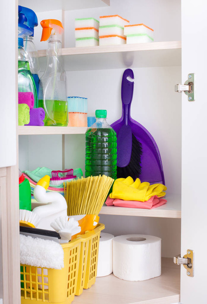 Cleaning tools and products in storage place - Foto, Bild