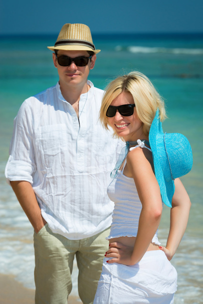Happy young couple on a tropical beach - Fotó, kép