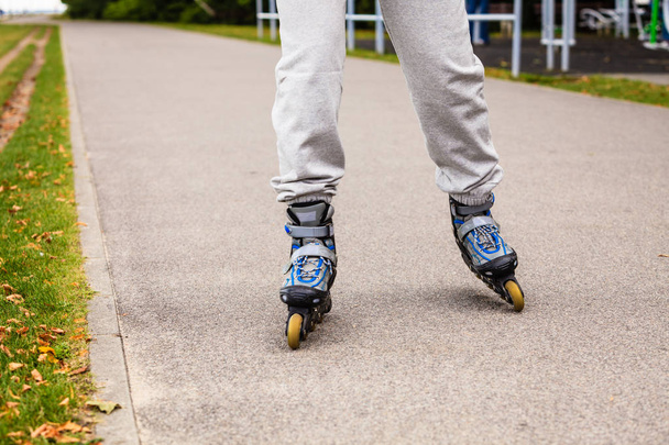 Human legs rollerblading wearing sportswear. - Photo, Image