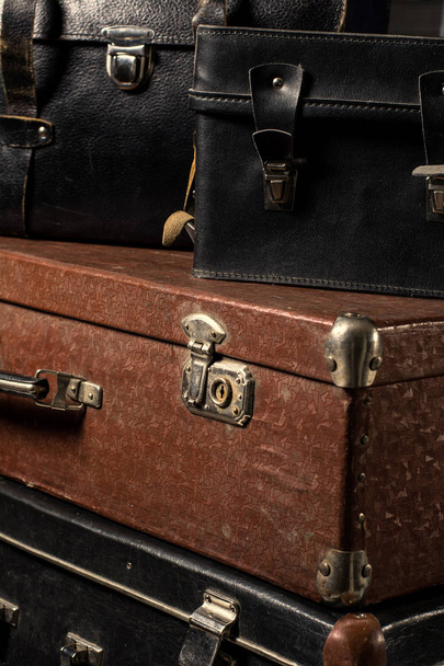 Close-up of a stack vintage shabby suitcases - Foto, Imagem
