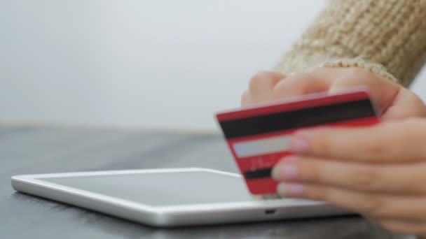 Woman shopping online at digital tablet with credit card - Footage, Video
