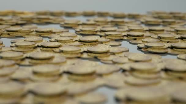 el fondo de una gran cantidad de monedas de oro en la mesa
 - Imágenes, Vídeo