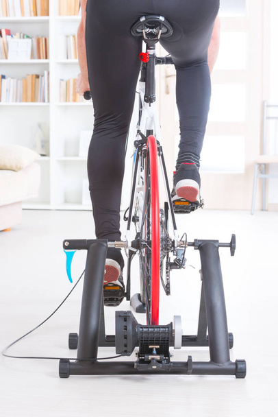 Man on bicycle trainer - Photo, Image