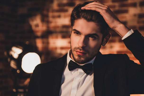 Portrait of handsome young sexy groom  touching his hair - Foto, Bild