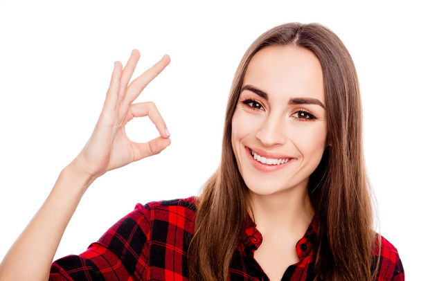 Happy beautiful girl showing ok gesture  and smiling - Фото, изображение