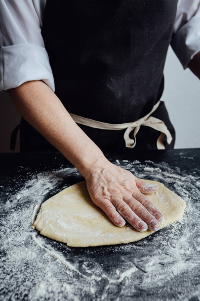 Person rolling homemade cookie dough - Фото, зображення