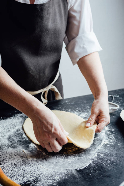 Person making shortcrust pastry - Фото, зображення