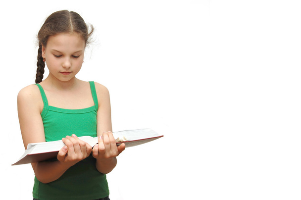 The young girl the teenager reads books - Φωτογραφία, εικόνα