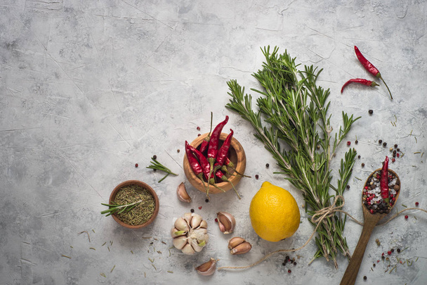 Herbs and spices at gray concrete table.  - Photo, Image