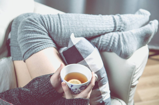 Relaxing concept with hot tea and sofa - Фото, зображення