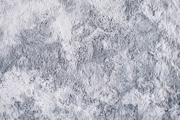 Сірим хутром килим
 - Фото, зображення