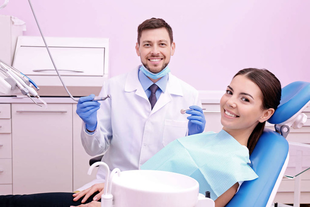 Dentist examining patients teeth - Foto, Imagem