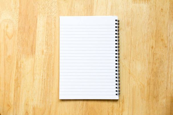 Blank paper note book on wood table background - Photo, Image