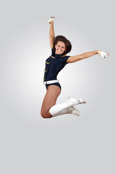 Young female dancer against white background - Фото, изображение