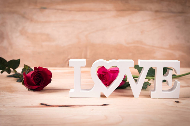 concept valentine day,red rose and text love  - 写真・画像
