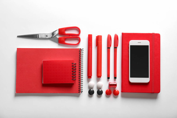 Flat lay composition of red stationery - Фото, изображение