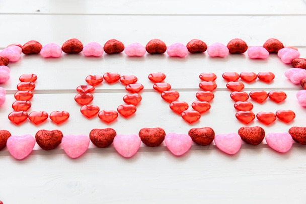 Valentines Day background with love text on grunge wooden desk - Foto, afbeelding
